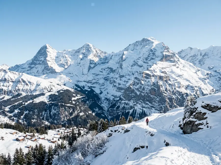 Snow-covered mountain peaks under a clear sky